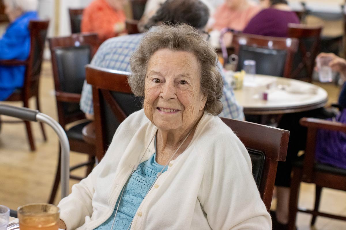 An Autumn Ridge resident at her table in the dining room